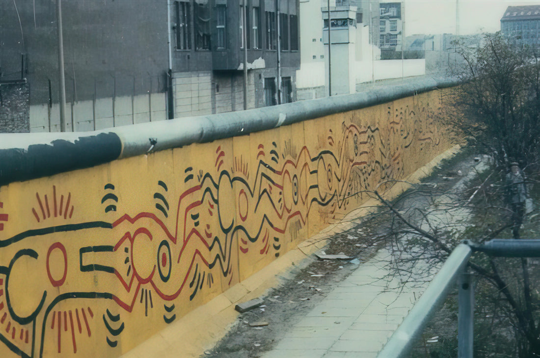 Keith Haring and Annie Leibovitz: The Intersection of Street Art and Celebrity Photography - BERLIN MURAL 1986 by Keith Haring